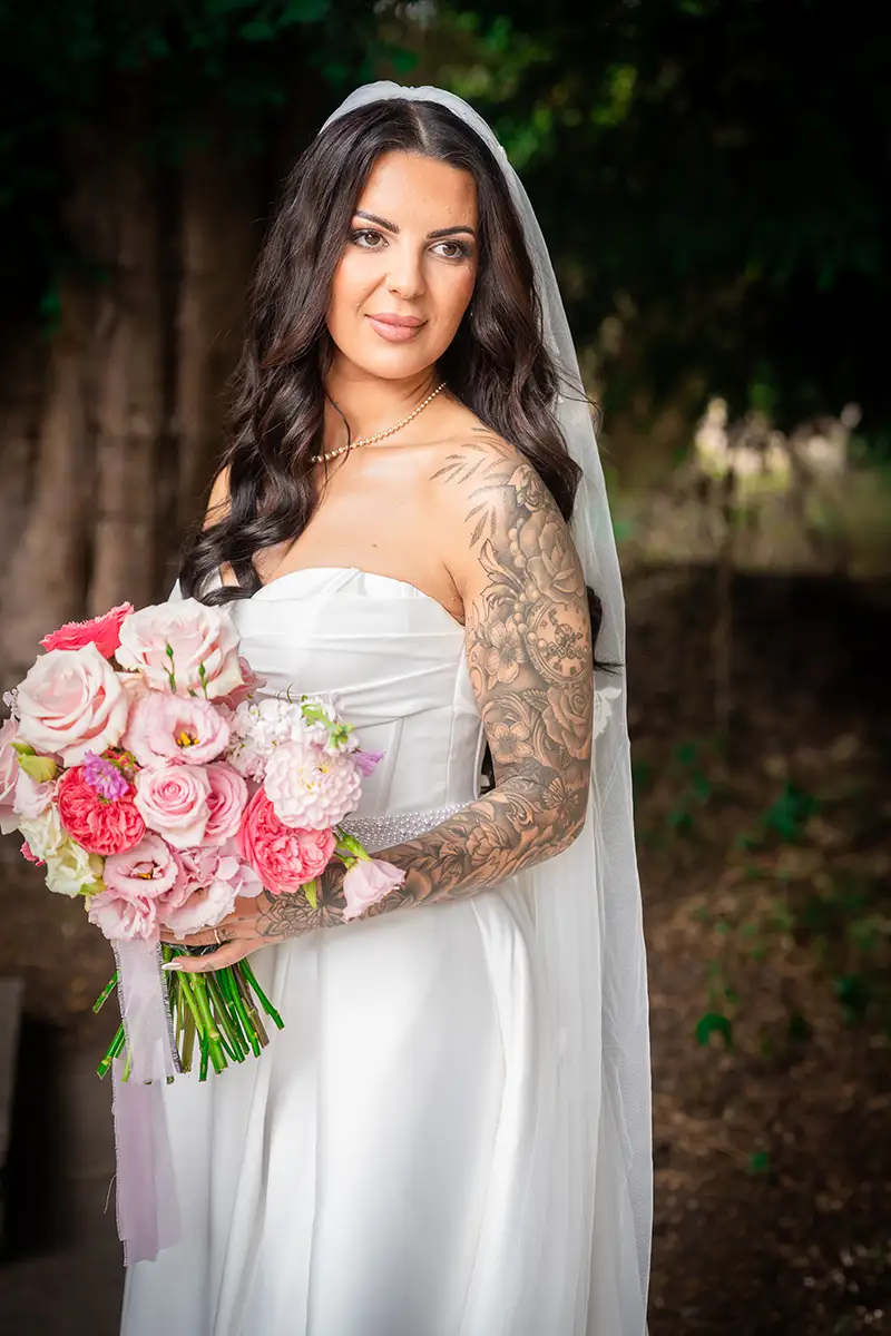 Bride Leila holding her bouquet at Nailcote Hall