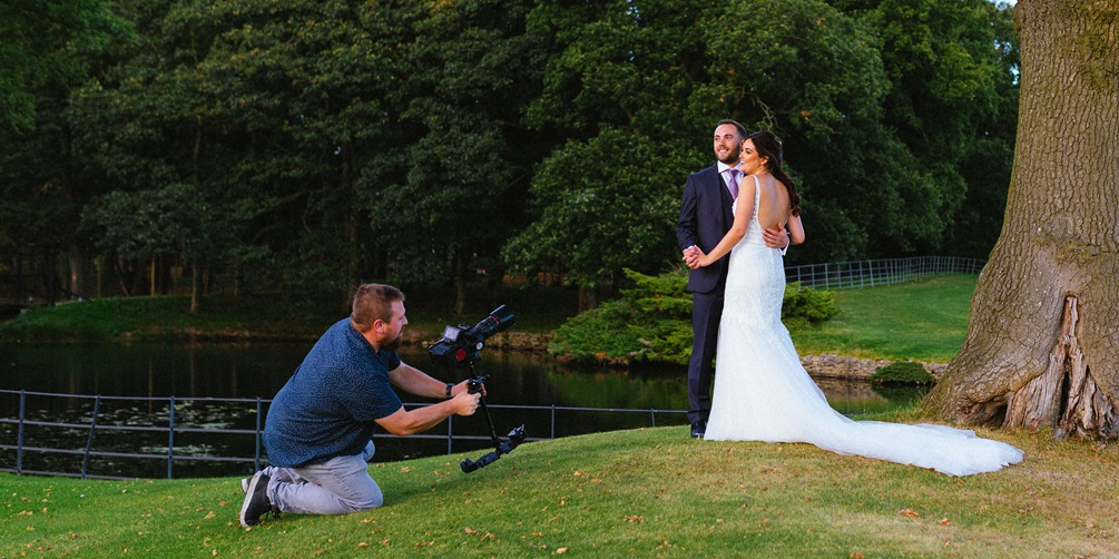Wedding photographer and videographer working together