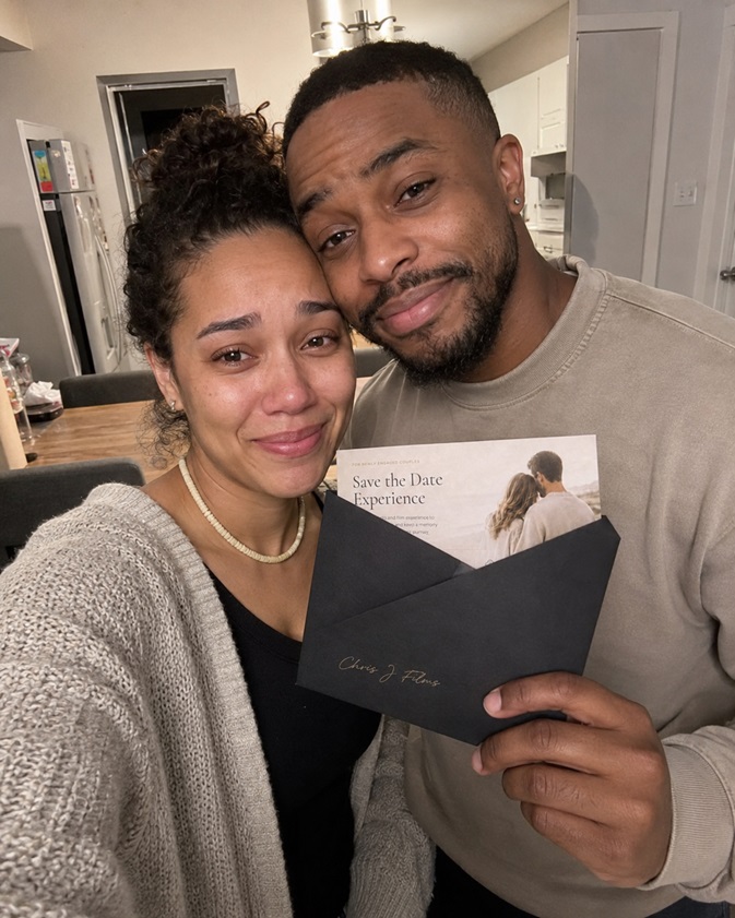 Couple sharing their Save the Date film with family